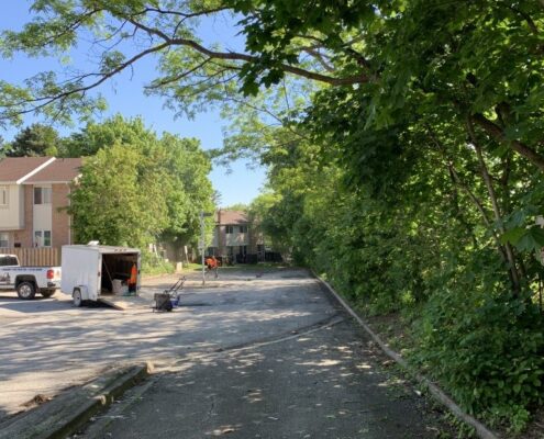Image depicts the before of an asphalt sealing project in North York