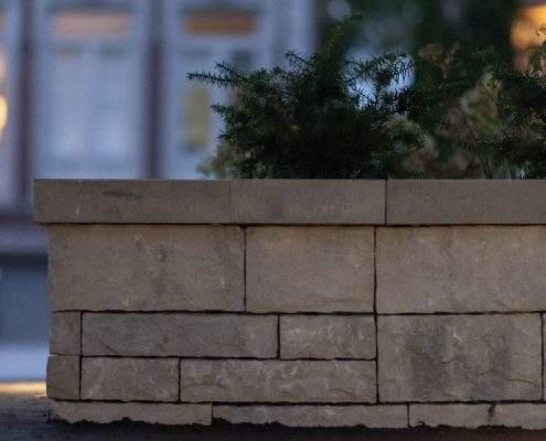 ahs custom retaining wall with glass railings lighting