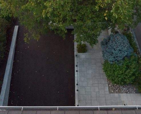 custom retaining wall with glass railings lighting ahs