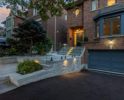 custom retaining wall with railings glass lighting