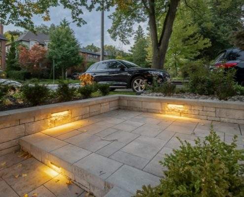 retaining custom wall with glass railings lighting