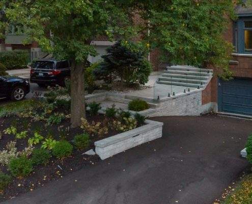 retaining wall with glass railings lighting
