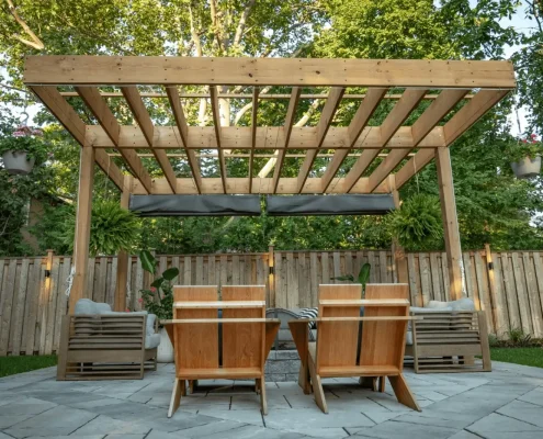 beautiful landscaping with custom fireplace