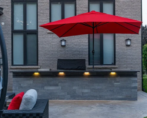 custom outdoor kitchen space with lighting