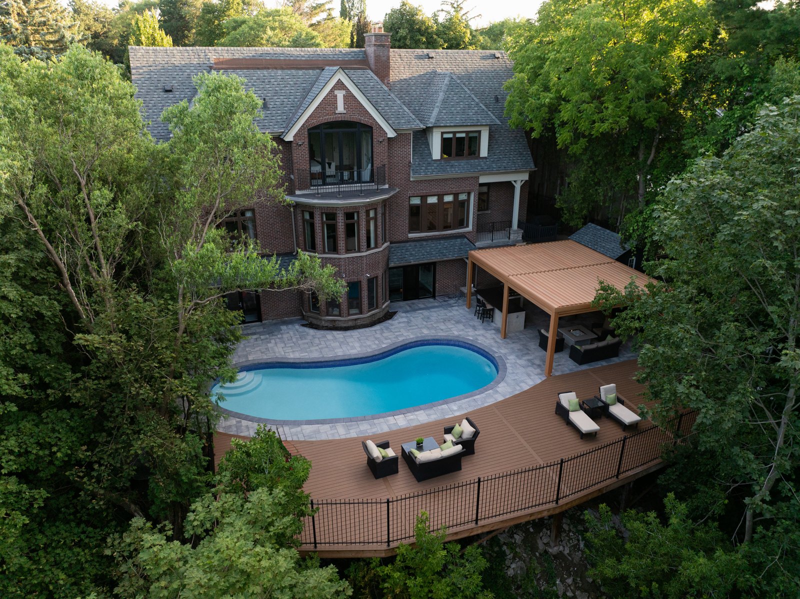Backyard pool and deck at a brick home in Toronto