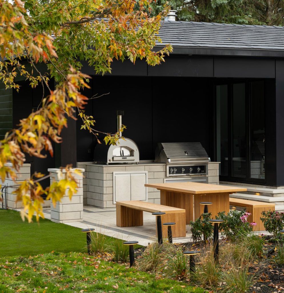 Outdoor kitchen with pizza oven in a Toronto backyard